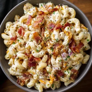 Creamy Bacon Cheddar Ranch Pasta Salad with ingredients in a bowl