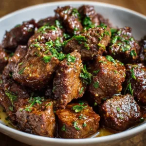 Delicious slow cooker garlic butter steak bites served on a plate.